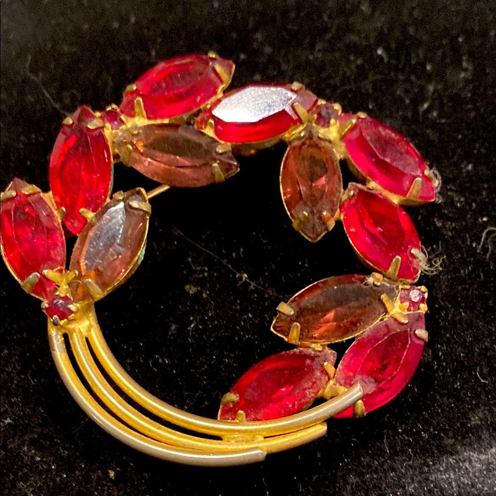 Red and Purple Prong Set Crystal in Gold Tone Brooch. Look it up.
